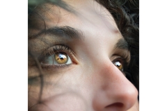 close up female face eyes wandering
